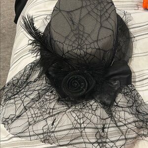 Elegant Black Lace Hat with Feather Accent